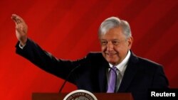 FILE - Mexico's President Andres Manuel Lopez Obrador gestures during his daily news conference at National Palace in Mexico City, Feb. 15, 2019.