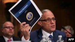 FILE - Fred Hochberg, Chairman and President of the Export-Import Bank of the United States, holds up a copy of the bank's Default Rate Report as he testifies before a congressional committee June 4, 2015 on Capitol Hill in Washington, D.C.
