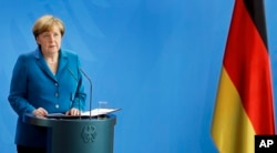 German Chancellor Angela Merkel addresses the media during a statement in Berlin, Germany, Saturday, July 23, 2016 on the Munich attack.