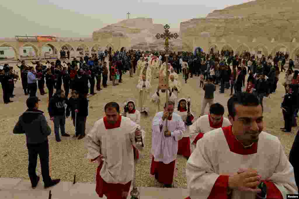 Catholics attend a mass at John the Baptist Church during the annual pilgrimage near the baptism site along the Jordan River, Shouneh, Jordan.