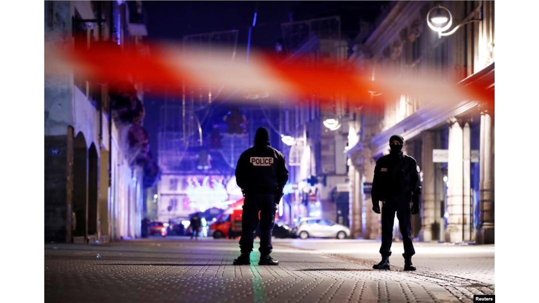 Police secure area where a suspect is sought after a shooting in Strasbourg, France, Dec. 12, 2018.