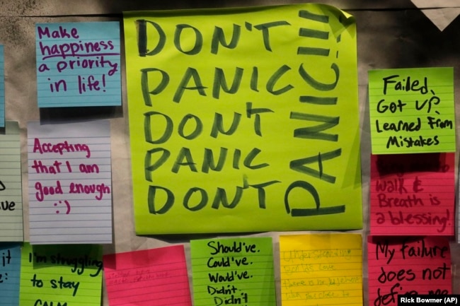 This November 14, 2019, photo shows notes attached to the Resilience Project board on the campus of Utah Valley University in Orem, Utah. The purpose of the project is to let students know that it is OK to struggle. (AP Photo/Rick Bowmer)