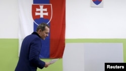 Radoslav Prochazka, a leader of Siet party, arrives to cast his vote at a polling station during the country's parliamentary election in Trnava, Slovakia, March 5, 2016. 