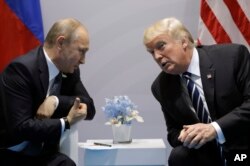 President Donald Trump meets with Russian President Vladimir Putin at the G-20 Summit, July 7, 2017, in Hamburg, Germany. Putin has rejected conlusions by the U.S. intelligence community that Russia interferred in last year's presidential elections in the U.S.