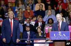 President-elect Donald Trump, left, listens to retired United States Marine Corps General James Mattis after appointing Mattis as upcoming Secretary of Defense while speaking to supporters during a rally in Fayetteville, N.C., Tuesday, Dec. 6, 2016.