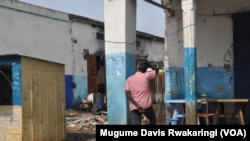 A man looks at what remains of a house in Malakal, South Sudan.