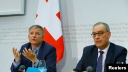 Switzerland's Defense Minister Guy Parmelin (R) and Swiss Federal Intelligence Service (NDB) director Markus Seiler attend a news conference in Bern, Switzerland, May 2, 2017.