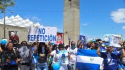 NICARAGUA – Members of the organization Mothers of April (AMA) hold portraits of their late loved ones outside the Cathedral in Managua on February 23, 2020.