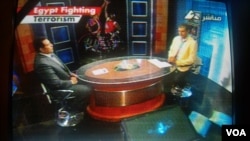 Egyptian television displays the "Egypt Fighting Terrorism" banner during a sports program, August 20, 2013. 