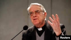 FILE - Vatican spokesman Father Federico Lombardi talks to reporters during a news conference at the Vatican. 