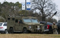 An armored law enforcement vehicle is seen in the area where a man has reportedly taken people hostage at a synagogue during services that were being streamed live, in Colleyville, Texas, Jan. 15, 2022.