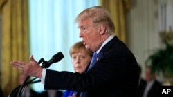 President Donald Trump speaks during a news conference with German Chancellor Angela Merkel in the East Room of the White House in Washington, April 27, 2018. 