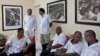 Cuban doctors, who will travel to Liberia and Guinea, wait for the start of a press event in Havana, Oct. 21, 2014. 