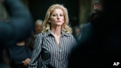 FILE- Summer Zervos leaves Manhattan Supreme Court at the conclusion of a hearing in New York, Dec. 5, 2017.
