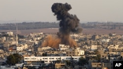 Smoke rises following an Israeli attack on Gaza City, Thursday, Nov. 15, 2012.