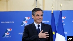 Francois Fillon puts his hand on his heart after delivering a speech following the conservative presidential primary, in Paris, France, Nov. 27, 2016. Fillon might face Valls in France's presidential election next year.