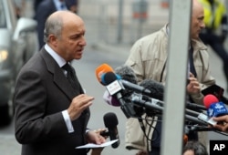 French Foreign Minister Laurent Fabius talks to media as he arrives at Palais Coburg where closed-door nuclear talks with Iran take place in Vienna, Austria, June 27, 2015.