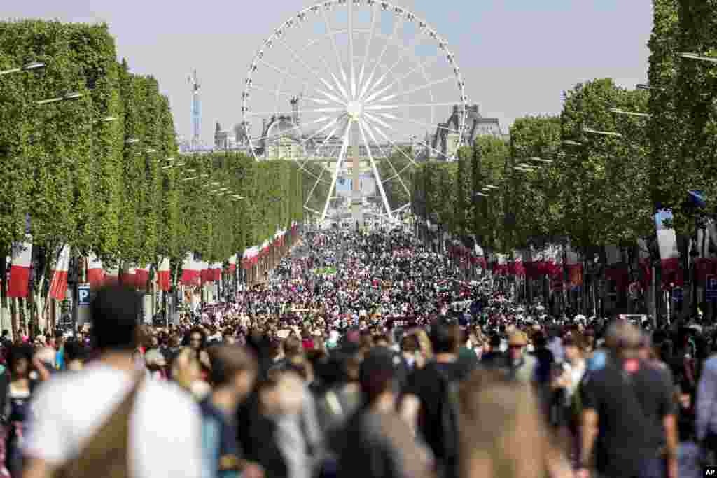 Pedestrians take over the Champs Elysees as part of a new program to ban traffic from the famous Paris avenue once a month. The initiative, for what is usually one of the busiest roads in the French capital, was launched by Paris Mayor Anne Hidalgo and is aimed at reducing pollution in the city.