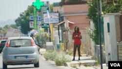 Nigerian streetwalker on the main street in Castel Volturno plying her trade. Italian authorities say one out of every two sex worker on the roads of Italy are Nigerian. (Photo: Jamie Dettmer for VOA)
