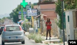 FILE - Nigerian streetwalker on the main street in Castel Volturno plying her trade. Italian authorities say one out of every two sex worker on the roads of Italy are Nigerian. (Photo: Jamie Dettmer for VOA)
