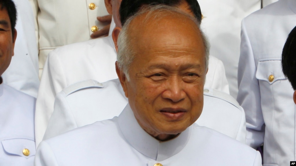 FILE - Prince Norodom Ranariddh and the royal FUNCIPEC Party walks together at the National Assembly, in Phnom Penh, Cambodia, Nov. 28, 2018.