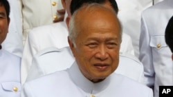 FILE - Prince Norodom Ranariddh and the royal FUNCIPEC Party walks together at the National Assembly, in Phnom Penh, Cambodia, Nov. 28, 2018.