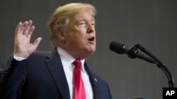 In this Nov. 26, 2018, photo, President Donald Trump speaks at a rally in Biloxi, Miss. Trump said on Nov. 27 that he was “very disappointed” that General Motors was closing plants in the United States.