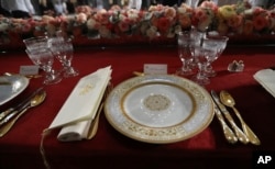 Table setting in Statuary Hall in the Capitol, Friday, Jan. 20, 2017 in Washington.