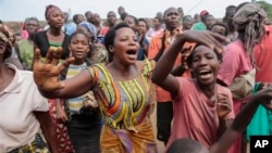 Burudians march in Bujumbura Musaga Neighborhood, Friday, June 5, 2015. Demonstrations continued in the capital on Friday, a day after it was announced that presidential and parliamentary elections would be postponed, following weeks of unrest over President Pierre Nkurunziza's bid for a third term in office. (AP Photo/Gildas Ngingo)