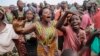 Burudians march in Bujumbura Musaga Neighborhood, Friday, June 5, 2015. Demonstrations continued in the capital on Friday, a day after it was announced that presidential and parliamentary elections would be postponed, following weeks of unrest over President Pierre Nkurunziza's bid for a third term in office. (AP Photo/Gildas Ngingo)