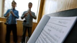 FILE - In this May 11, 2010 file photo, students learn to play music at the Afgan National Institute of Music, ANIM, in Kabul, Afghanistan.