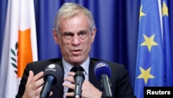 Cyprus' Finance Minister Michalis Sarris holds a news conference at the end of a Eurogroup meeting at the European Council building in Brussels, March 25, 2013.