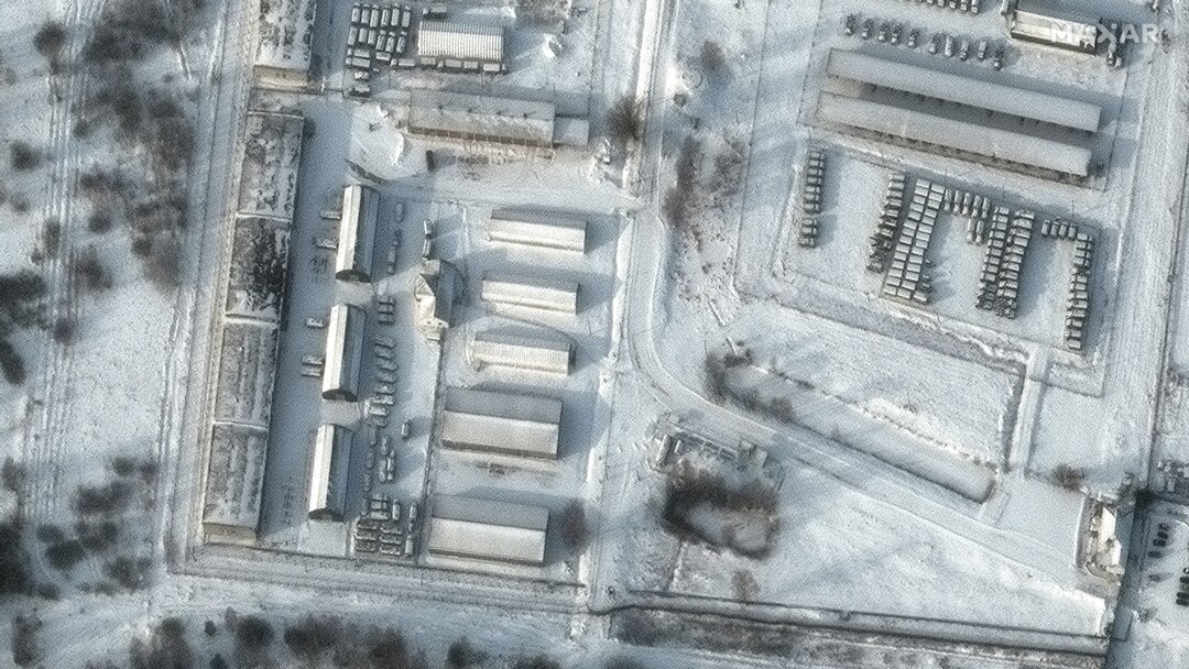 FILE - This handout satellite image released by Maxar Technologies shows armored personnel carriers and trucks at Klimovo storage facility, in Russia's Bryansk region, some 13 kilometers north of its border with Ukraine, Jan. 19, 2022.
