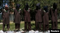 FILE - Insurgents suspected of being from the Haqqani network are presented to the media at the National Directorate of Security headquarters in Kabul, May 30, 2013.