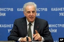 FILE - Michel Kazatchkine, executive director of the Global Fund to Fight AIDS, Tuberculosis and Malaria, speaks to reporters at a news conference in Kyiv, Ukraine