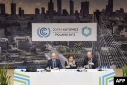 U.N. Climate chief Patricia Espinosa (C) is flanked by officials during a press conference at the COP24 climate change summit in Katowice, Poland, Dec. 2, 2018.