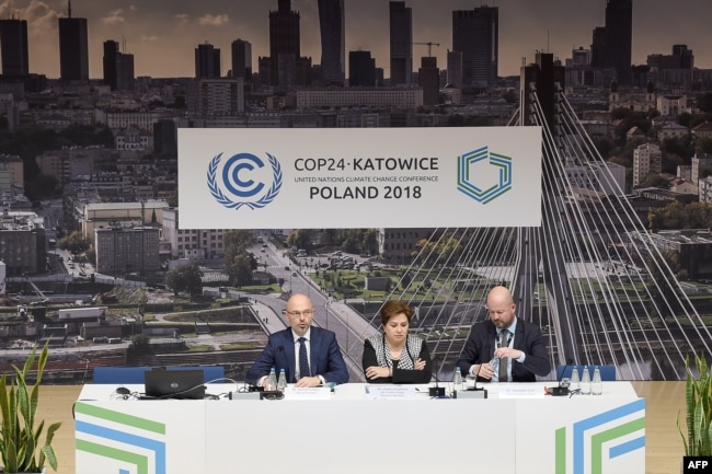 U.N. Climate chief Patricia Espinosa (C) is flanked by officials during a press conference at the COP24 climate change summit in Katowice, Poland, Dec. 2, 2018.