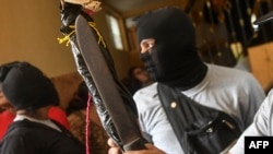 Paramilitaries burst into the San Sebastian Basilica, in Diriamba, Nicaragua, July 9, 2018.