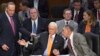 From left, Sen. Chuck Schumer, D-N.Y., standing, Sen. Orrin G. Hatch, R-Utah, and Sen. Chuck Grassley, R-Iowa, confer as the Senate Judiciary Committee meets on immigration reform on Capitol Hill in Washington, Thursday, May 9, 2013.