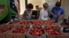 Women choose Dutch tomatoes at a supermarket in downtown Moscow, Aug. 7, 2014. 
