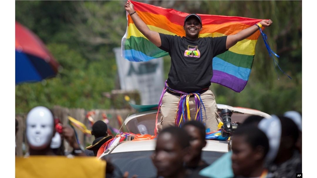 FILE - Ugandans take part in the 3rd Annual Lesbian, Gay, Bisexual and Transgender (LGBT) Pride celebrations in Entebbe, Uganda, Aug. 9, 2014.