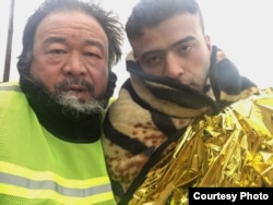 Ai Weiwei with refugee in scene from 'Human Flow' documentary.