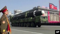 In this image made from video by North Korea's KRT, a military parade is held in Pyongyang, North Korea, Feb. 8, 2018. North Korea's intercontinental ballistic missiles highlighted the event.