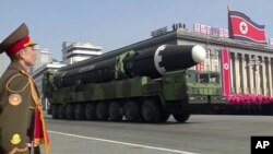 FILE - In this image made from video by North Korea's KRT, a military parade is held in Pyongyang, North Korea, Feb. 8, 2018. North Korea's intercontinental ballistic missiles highlighted the event.