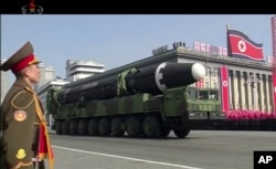 FILE - In this image made from video by North Korea's KRT, a military parade is held in Pyongyang, North Korea, Feb. 8, 2018. North Korea's intercontinental ballistic missiles highlighted the event.