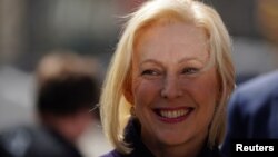 FILE - Democratic 2020 U.S. presidential candidate and U.S. Senator Kirsten Gillibrand (D-NY) stands and waits to take the stage during her campaign kick off event in New York, New York, March 24, 2019. 