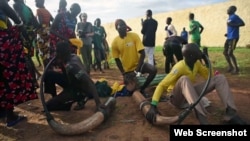 Chanting and singing prep for South Sudan 'wrestling for peace'.