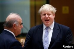 Britain's Foreign Secretary Boris Johnson talks to Malta's Foreign Minister George Vella, (left) during a European Union foreign ministers meeting in Brussels, Belgium, January 16, 2017.