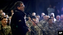 Defense Secretary Ashton Carter speaks with U.S. military personnel at Kandahar Airfield in Afghanistan, Feb. 22, 2015.