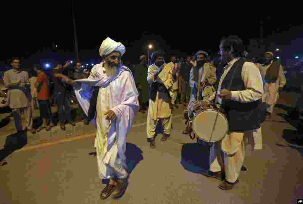 Supporters of Ashraf Ghani Ahmadzai celebrate with music and dancing near his residence after he was named the winner and next president by the Afghan election commission, in Kabul, Afghanistan, Sept. 21, 2014.